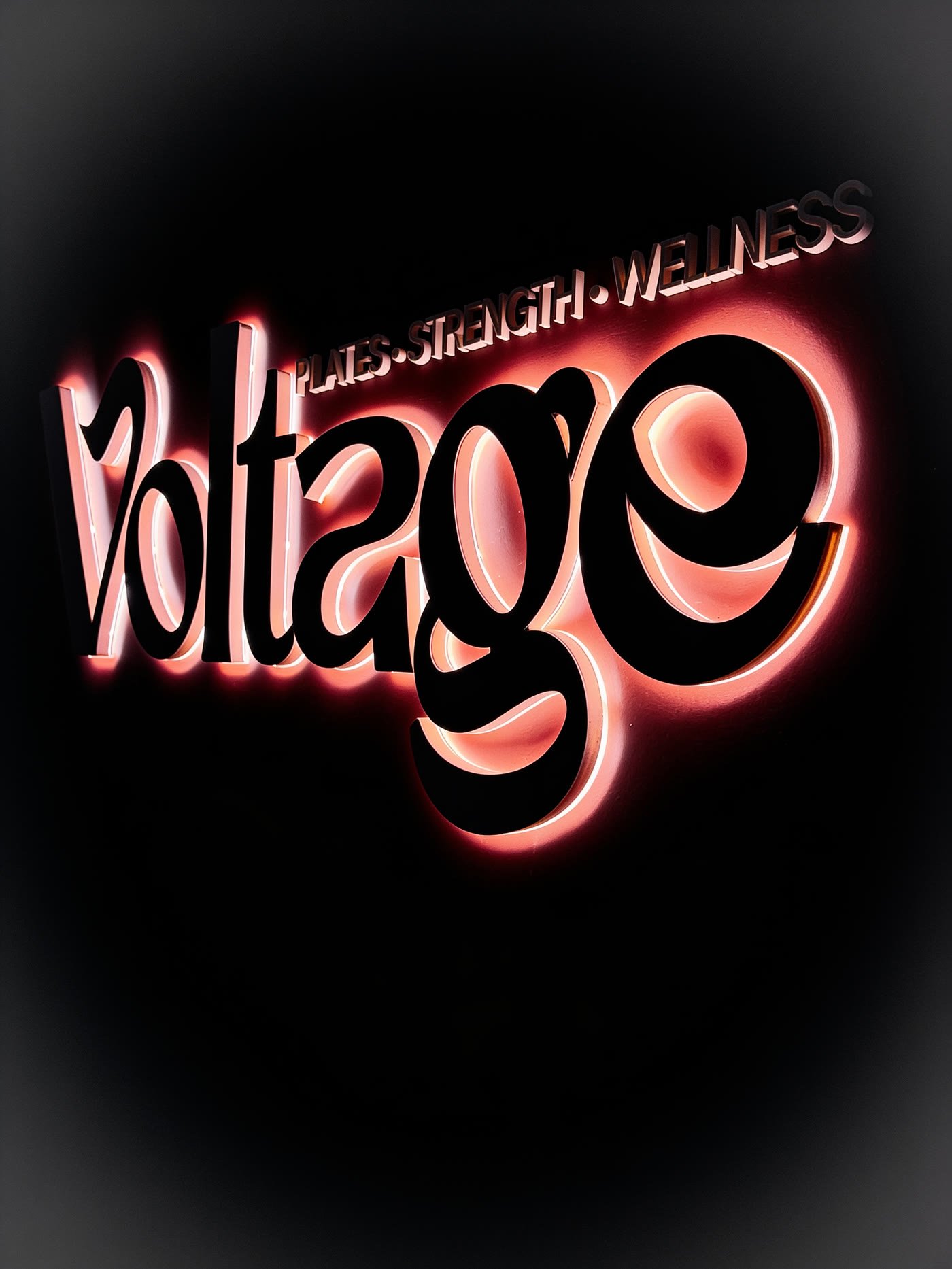 Script channel letters with a warm halo glow